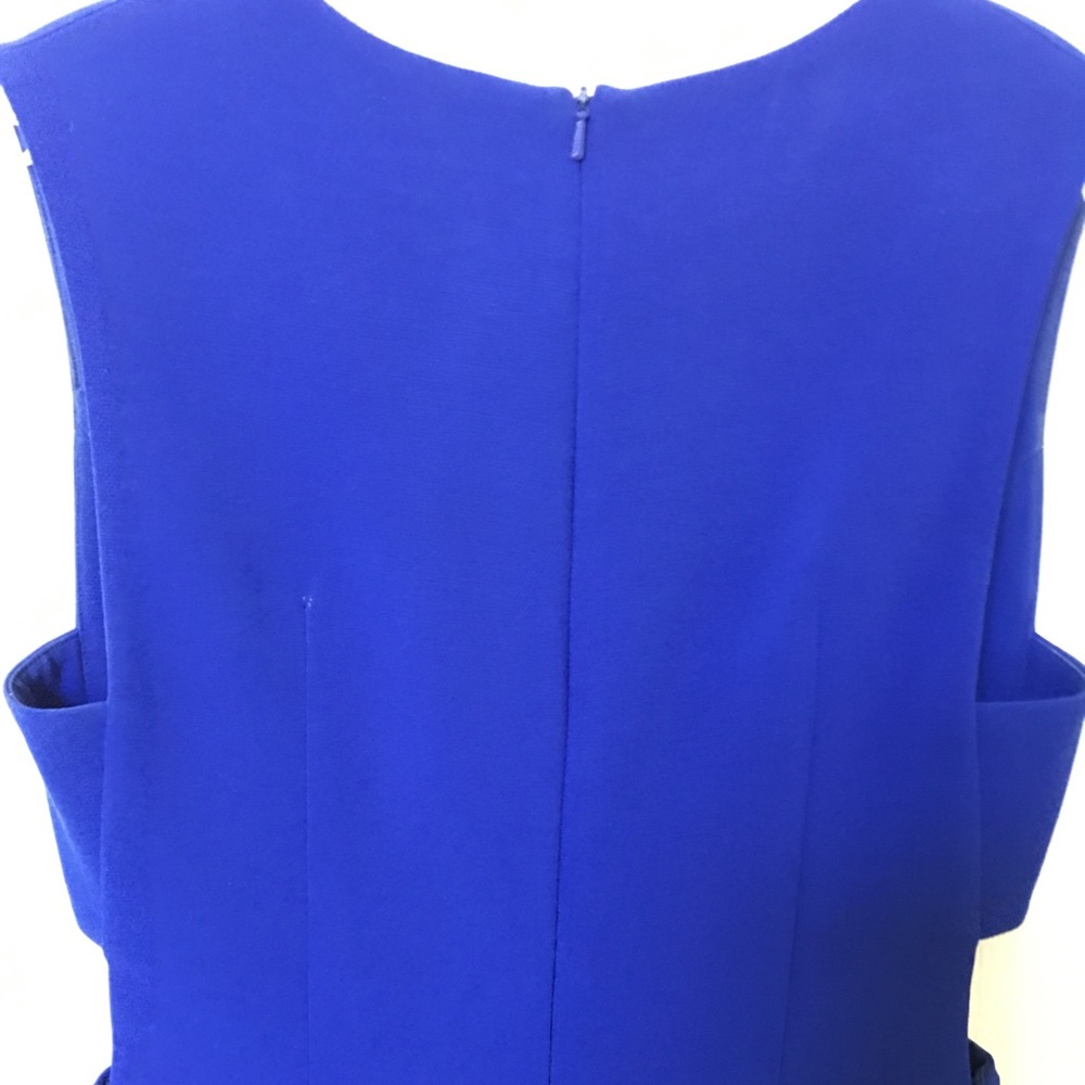 Clove Blue Dress with tasteful cut-outs at ribs.